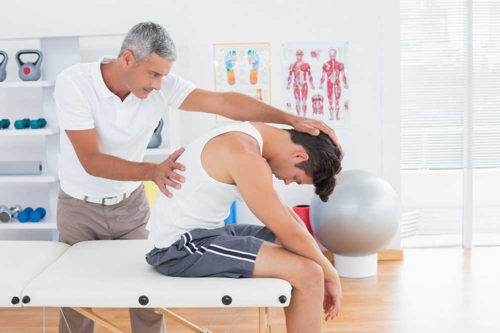 Man receiving chiropractic treatment