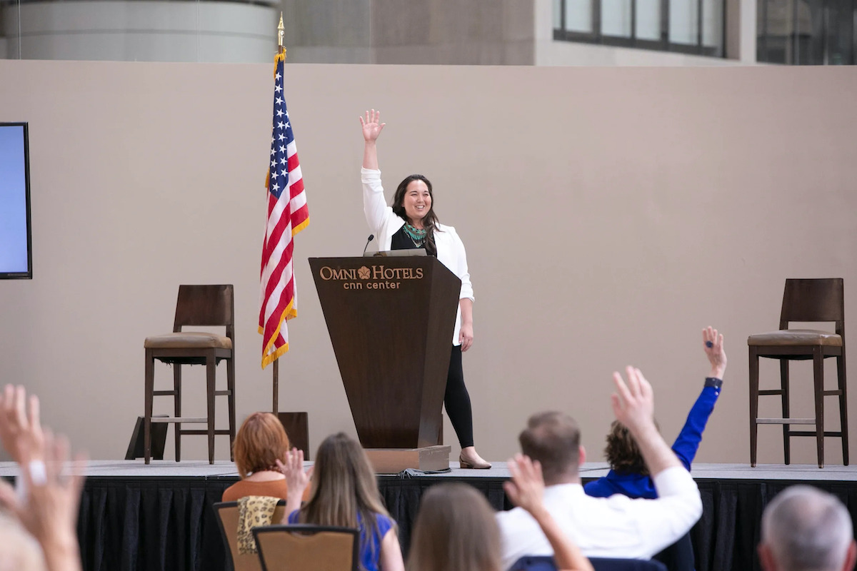 Dr Tran giving a speech